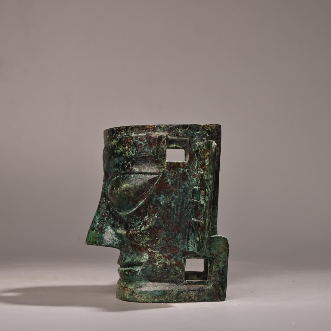 A bronze three-star mask - 3