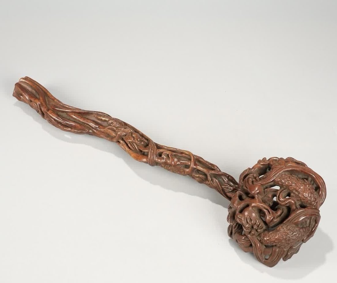 A Qing Dynasty yellow pear carved rice ear bergamot ruyi: Qing Dynasty Huanghuali carved rice ear Buddha's hand pattern ruyi SIZE: L:34.5cm W:9cm W:125g (The Dimensions Of All Batches Are Manually Measured.If You Need More Detailed Information, Please Contac