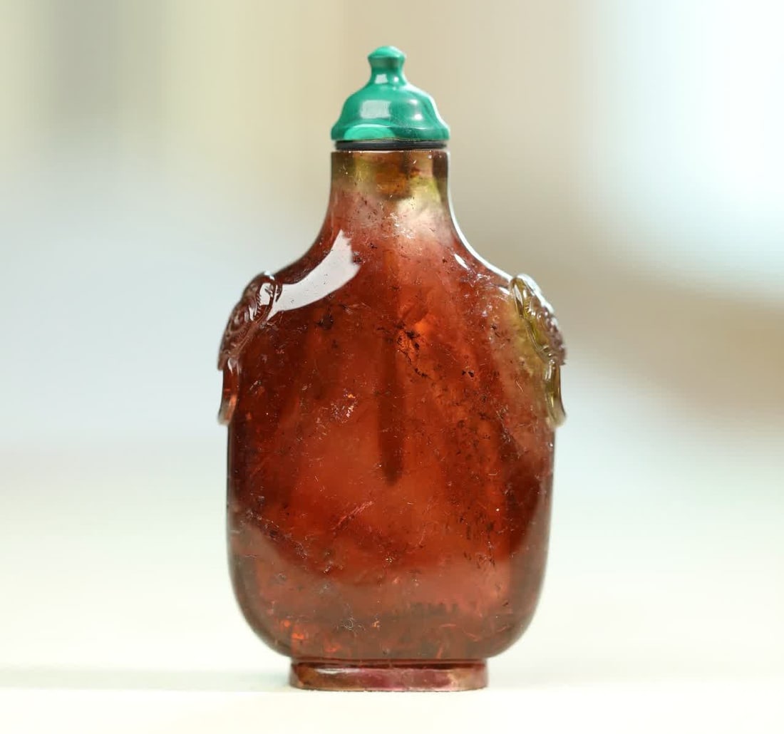 A Qing Dynasty tourmaline caramel-colored tourmaline beast head ring snuff bottle: Qing Dynasty tourmaline caramel tourmaline beast head ring snuff bottle SIZE: H:7.92cm W:4.33cm T:1.68cm W:78g (The Dimensions Of All Batches Are Manually Measured.If You Need More Detailed Informatio