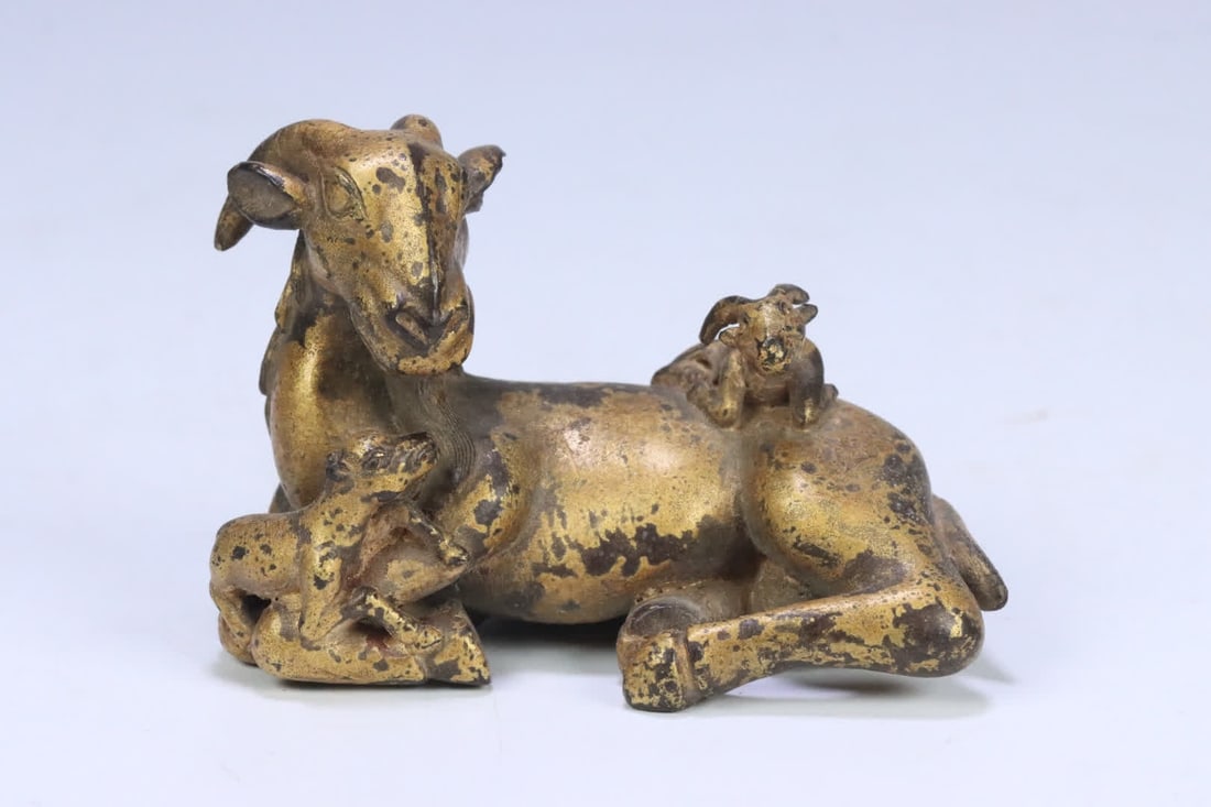 A piece of Qing Dynasty copper clay gold three sheep Kaitai paperweight (1 of 9)