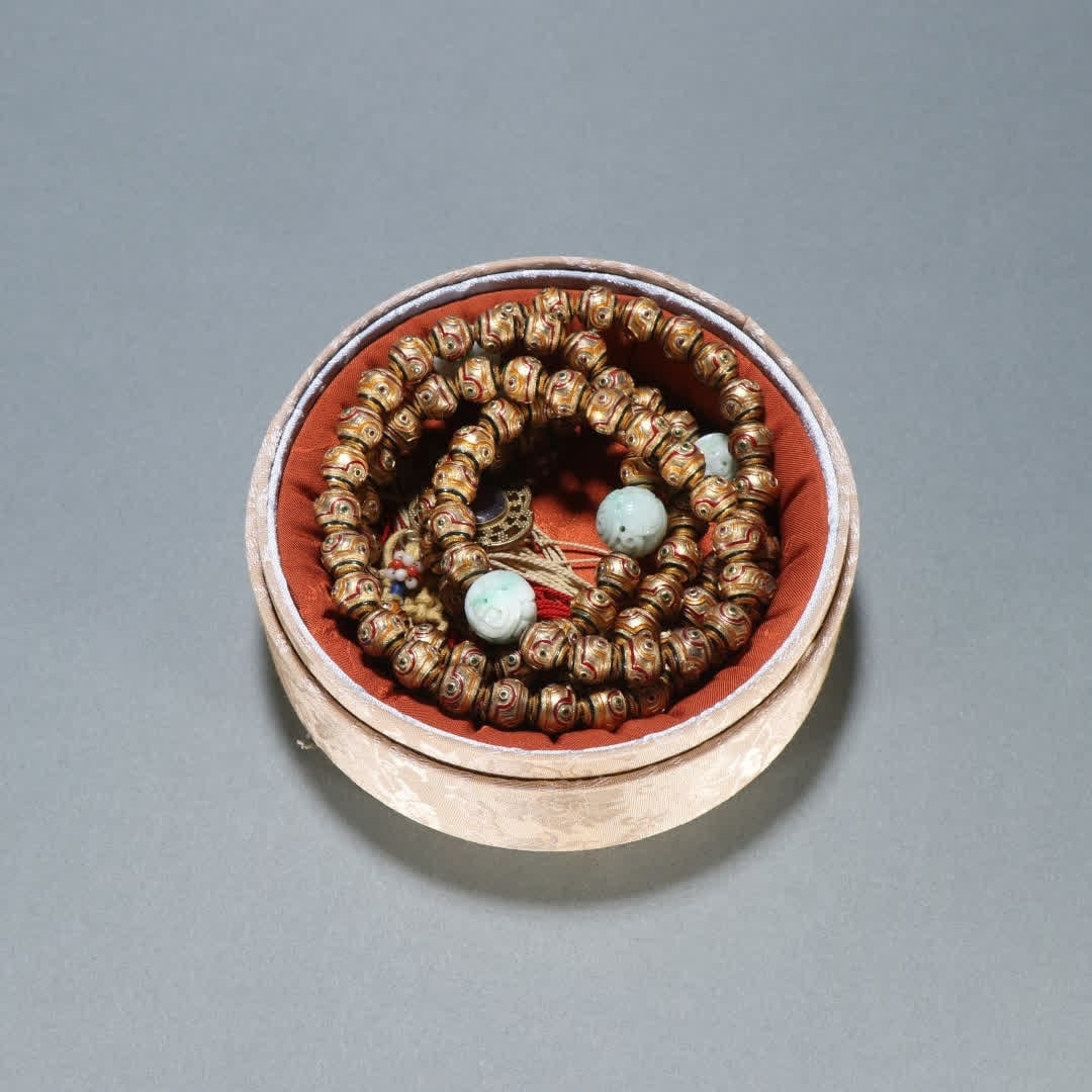 A Qing Dynasty copper-gilt 108 Buddha bead (1 of 9)