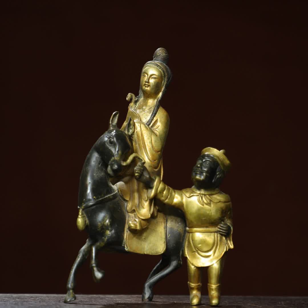 A statue of Qing Dynasty bronze gilt Zhaojun out of the frontier: Qing Dynasty bronze gilt Zhaojun out of the frontier SIZE: H:21cm W:13cm T:6cm W:1.1kg (The Dimensions Of All Batches Are Manually Measured.If You Need More Detailed Information, Please Contact Our
