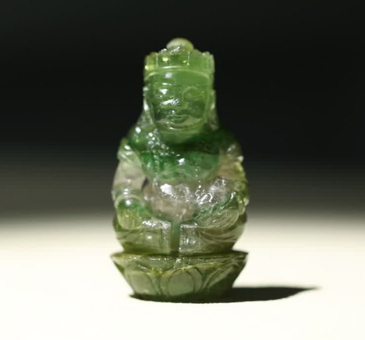 A Qing Dynasty Tibetan green tourmaline yellow God of Wealth Dharma statue (1 of 8)