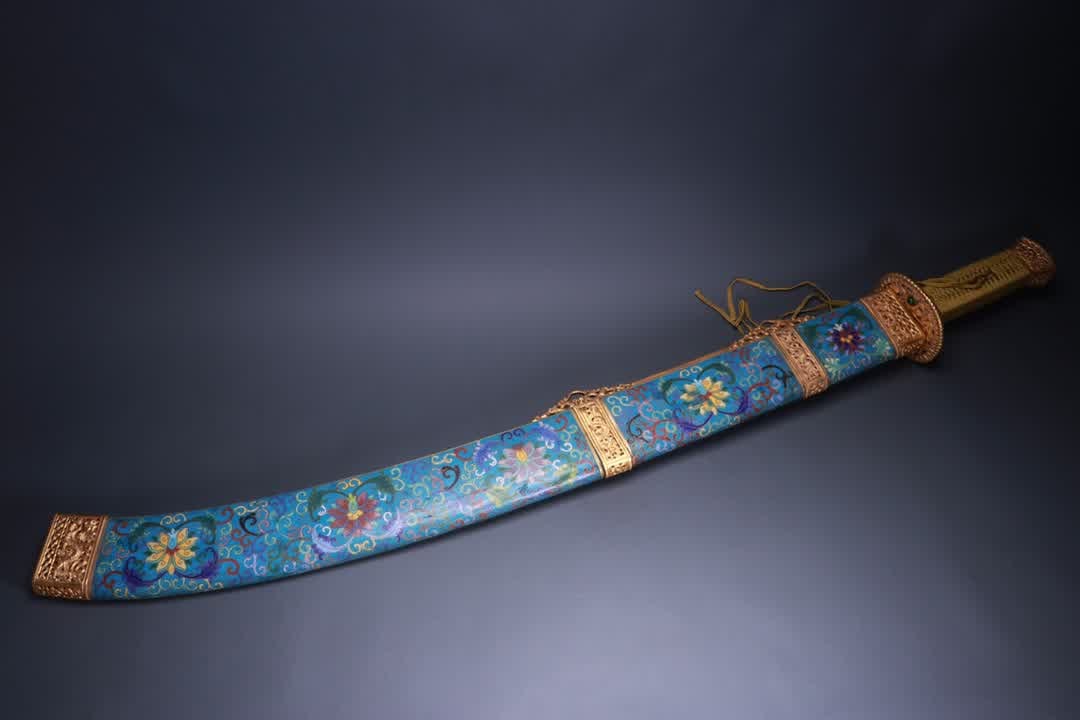 A Qing Dynasty cloisonné gilt entwined saber (1 of 9)