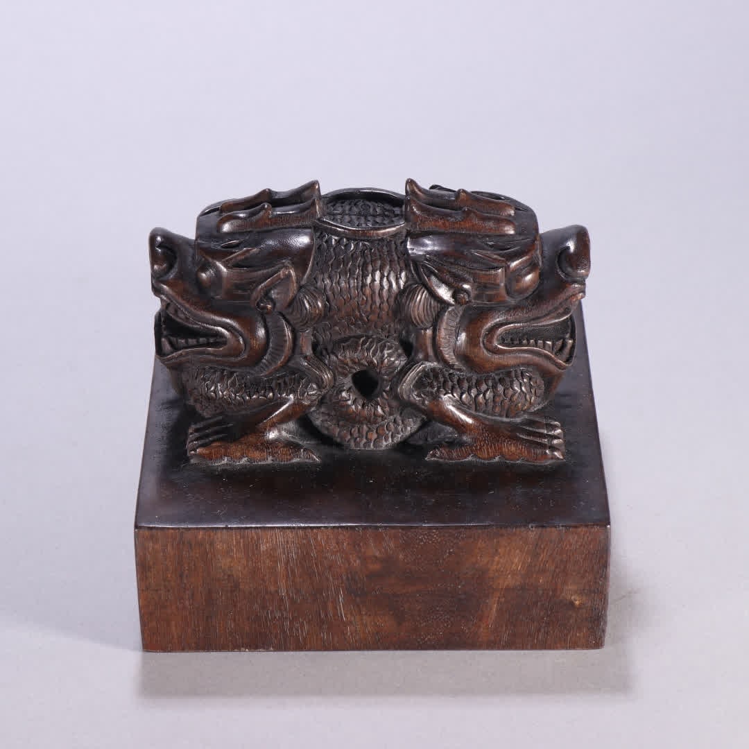 A Qing Dynasty agarwood dragon button seal (1 of 9)