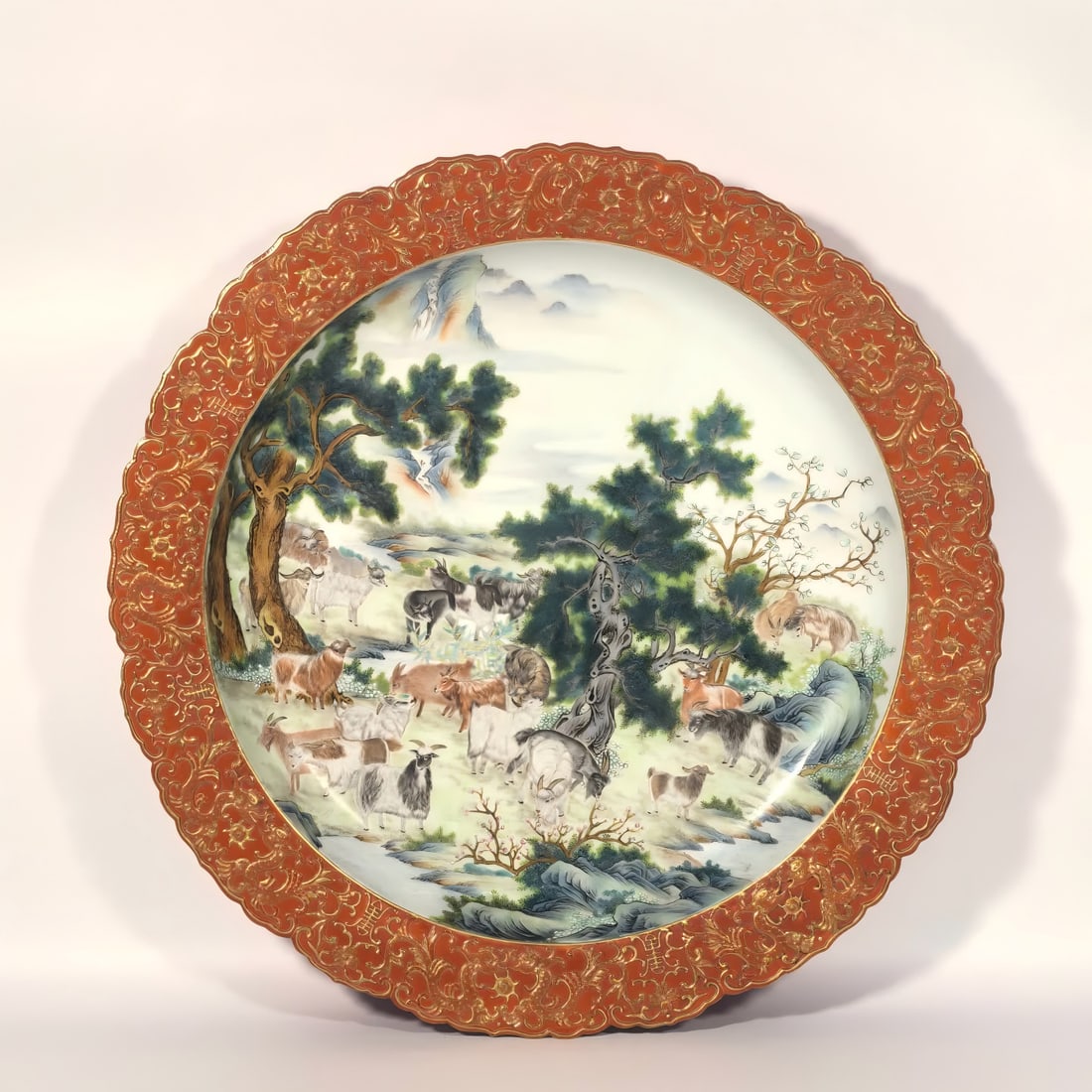 A Qing Dynasty Qianlong enamel alum red carved Hundred Sheep Plate (1 of 9)