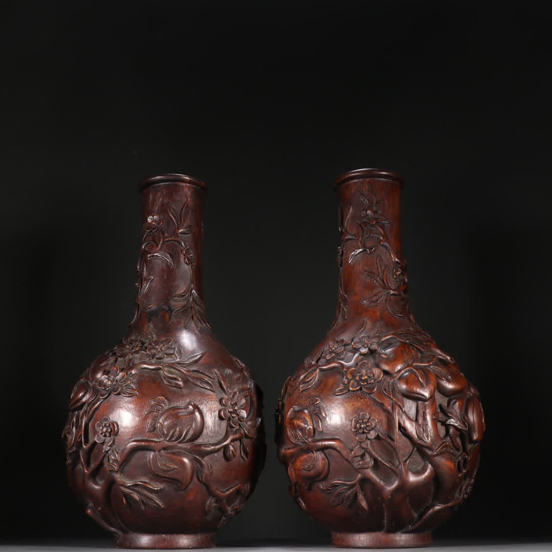 A pair of Qing Dynasty agarwood peach blossom bottles: A pair of Qing Dynasty agarwood peach blossom vases SIZE: H:32cm W:17cm W:634.3g (The Dimensions Of All Batches Are Manually Measured.If You Need More Detailed Information, Please Contact Our Customer