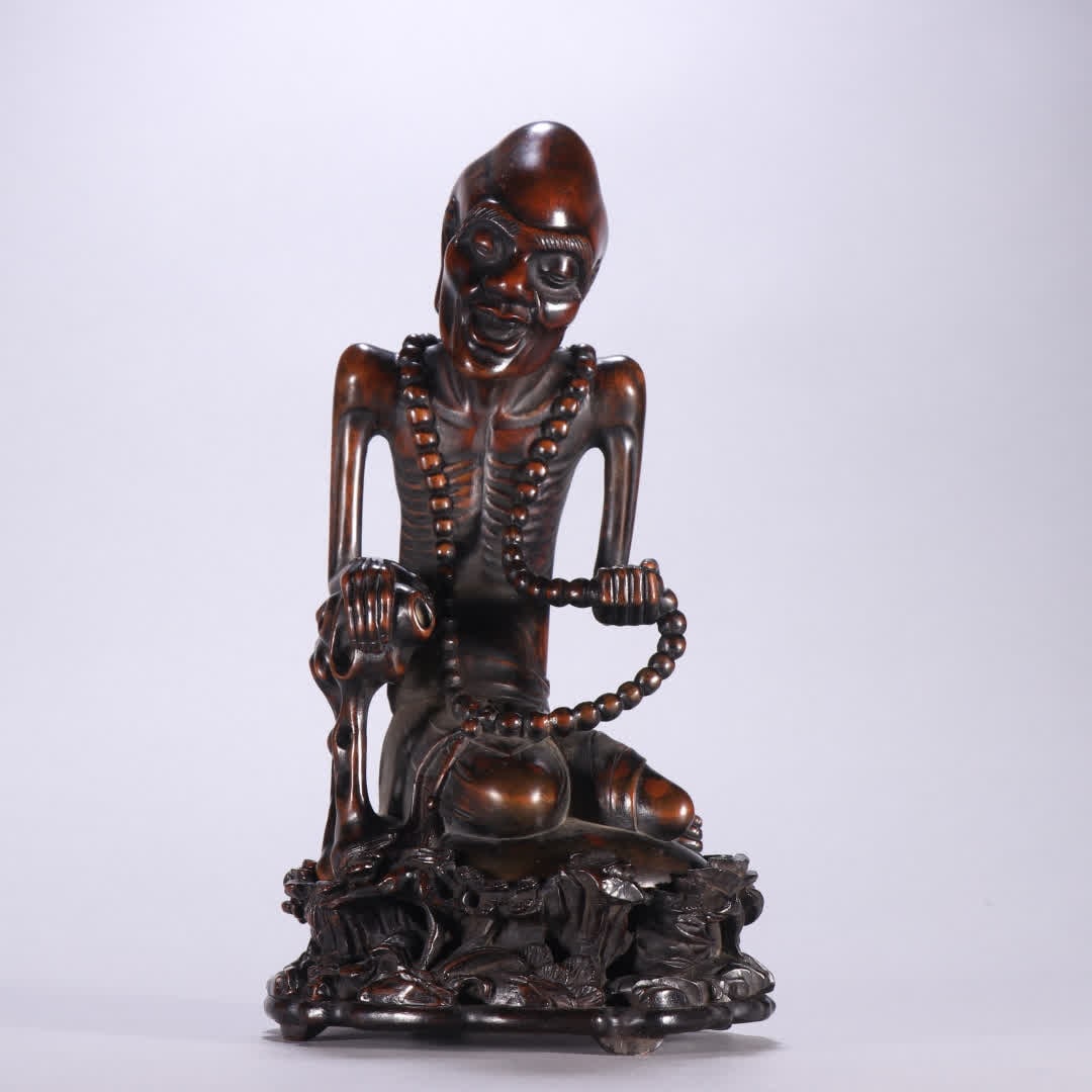 A Qing Dynasty boxwood with rosewood skinny Arhat ornament (1 of 9)