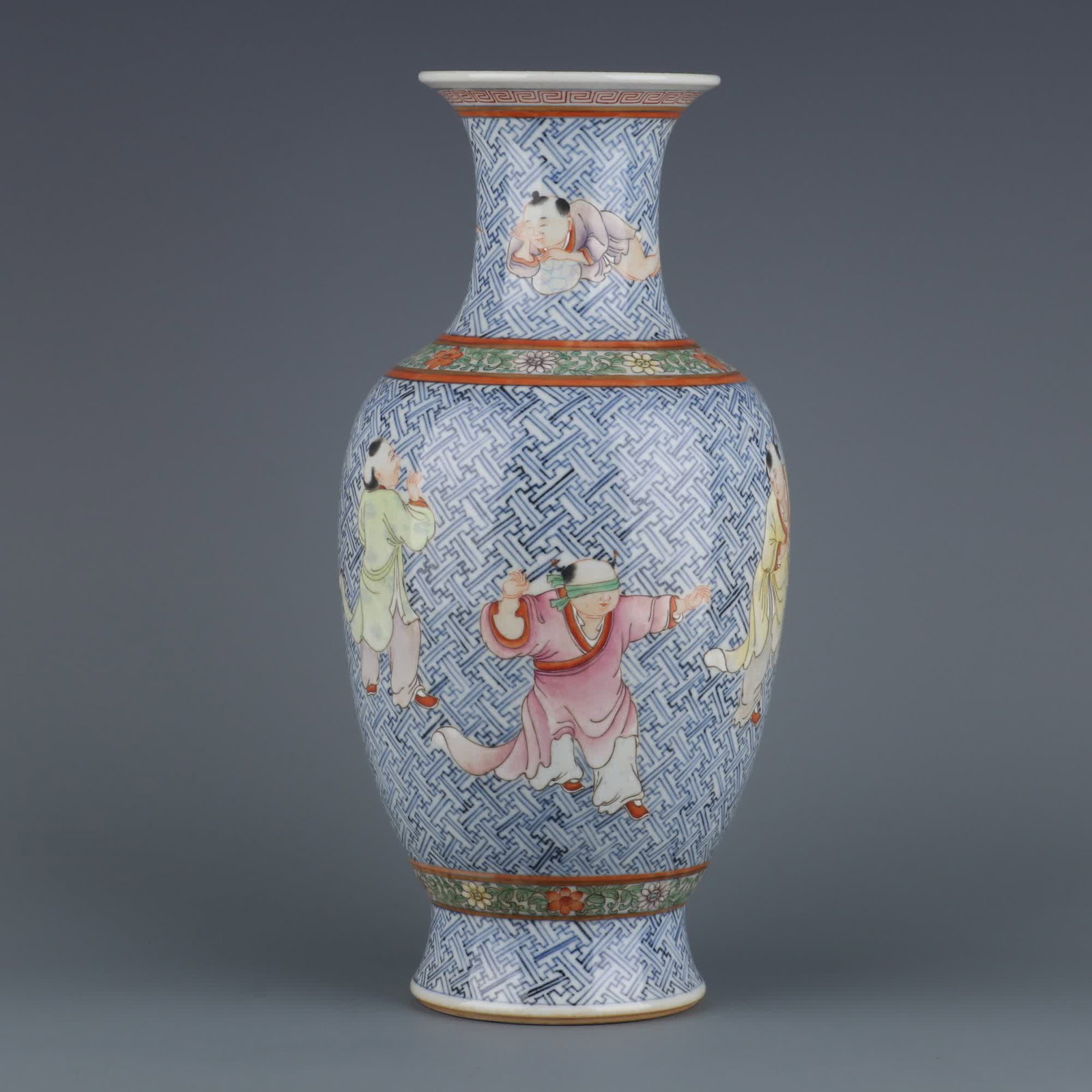 A blue and white brocade pastel baby play picture appreciation bottle made in the Qianlong period of: Qing Dynasty Qianlong year blue and white brocade pastel baby play picture appreciation bottle SIZE: H:32.3cm MouthD:10.2cm (The Dimensions Of All Batches Are Manually Measured.If You Need More Detail
