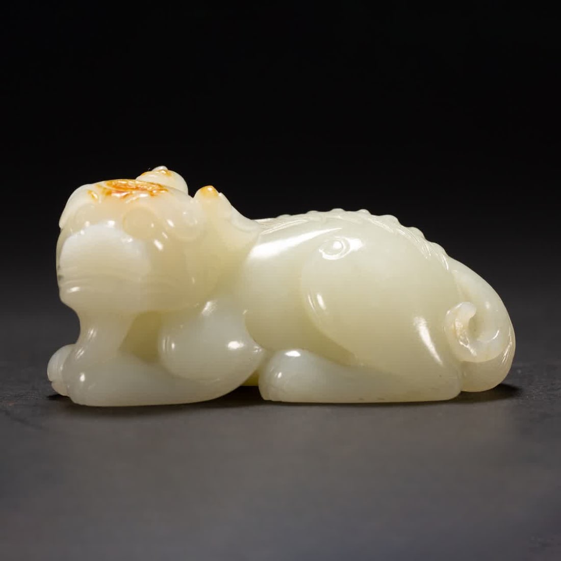 A Qing Dynasty Hetian jade beast (1 of 7)