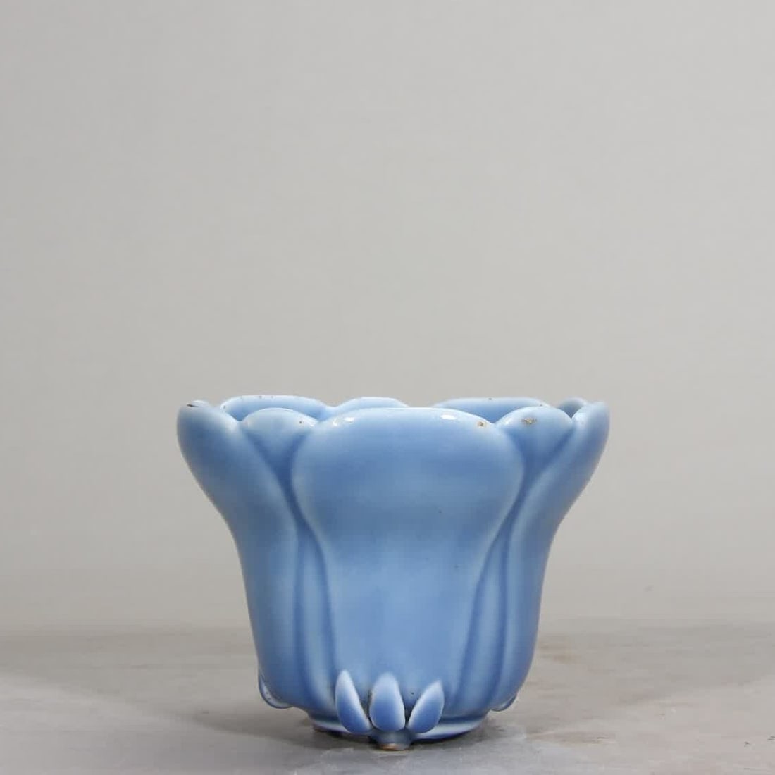 A Qing Dynasty Qianlong sky blue glazed magnolia cup (1 of 10)