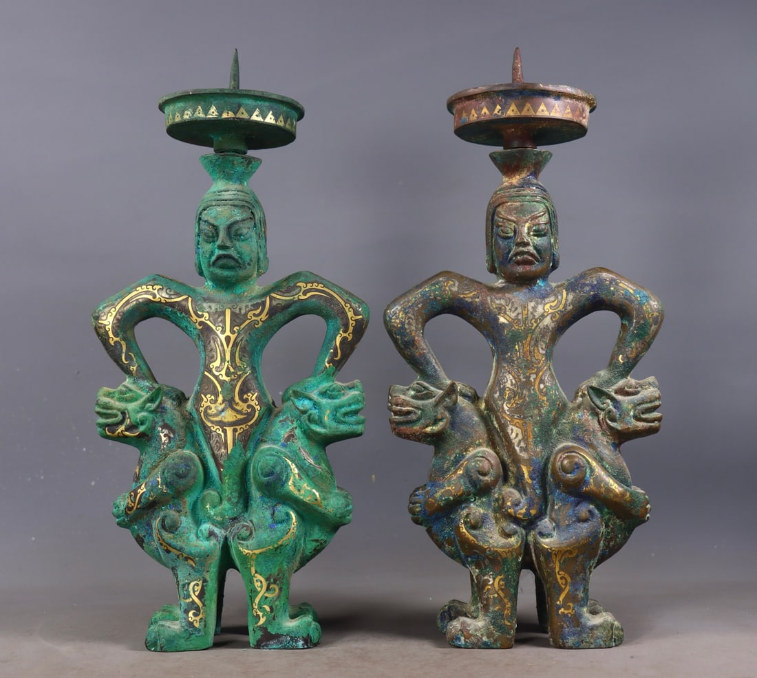 A Pair of Exquisite Bronze Inlaid Gold and Silver Figure-Shaped Candlestick: A Pair of Exquisite Bronze Inlaid Gold and Silver Figure-Shaped Candlestick Han Dynasty, China Size:34cmx15.5cmx6.5cm Weight:4219g (The Dimensions Of All Batches Are Manually Measured.If You Need