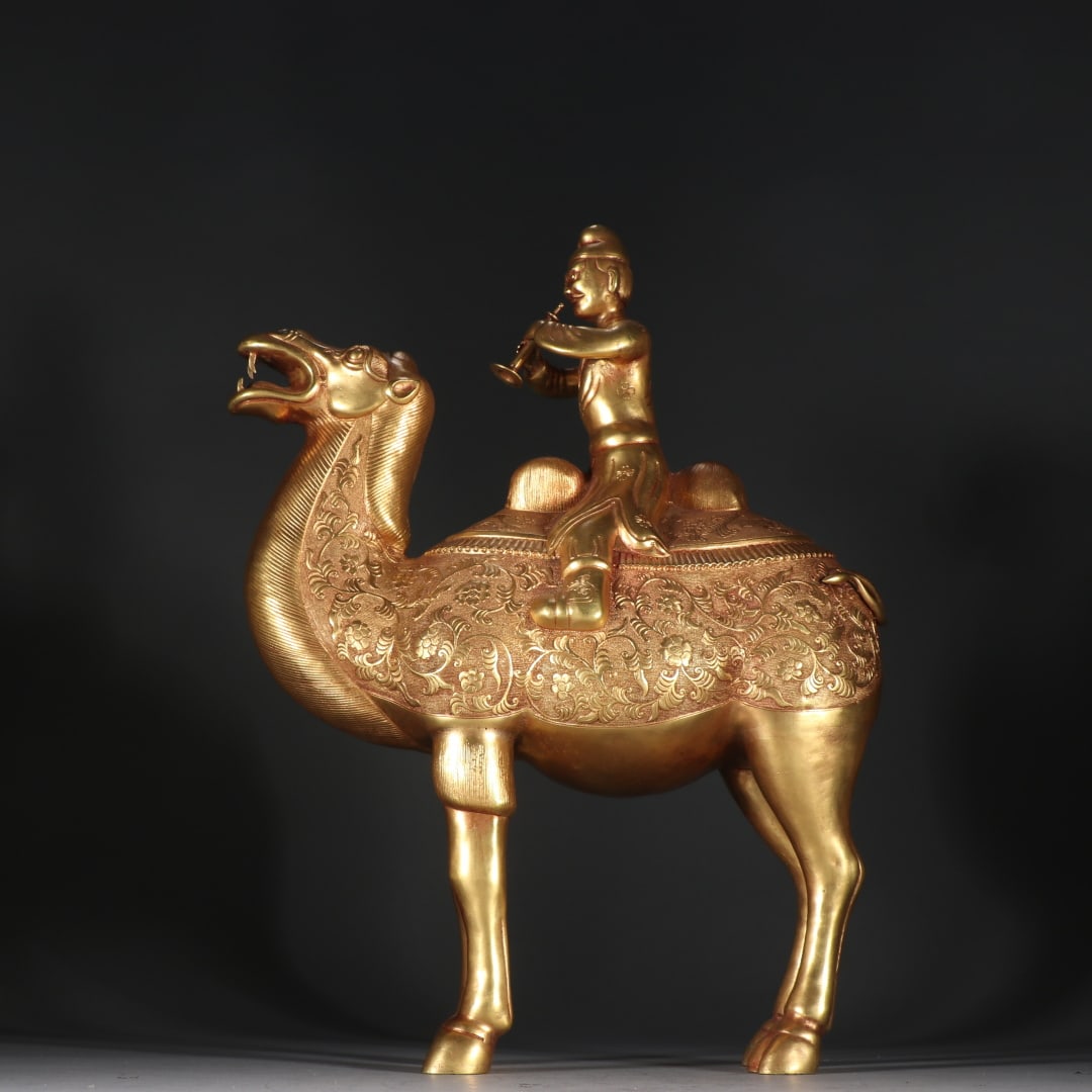 An Exquisite Gilt Bronze Camel Ornament: An Exquisite Gilt Bronze Camel Ornament Tang Dynasty, China Size:37cmx27cm Weight:1902.4g (The Dimensions Of All Batches Are Manually Measured.If You Need More Detailed Information, Please Contact
