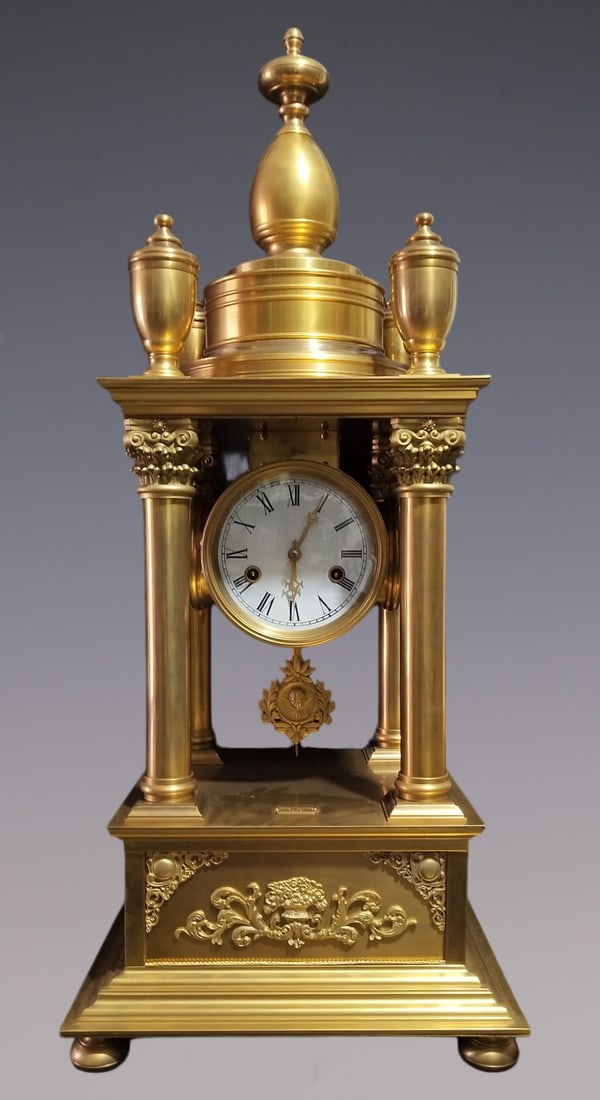 An Exquisite Gilt Bronze Clock: An Exquisite Gilt Bronze Clock Qing Dynasty, China Size:80cmx35cmx35cm (The Dimensions Of All Batches Are Manually Measured.If You Need More Detailed Information, Please Contact Our Customer Service