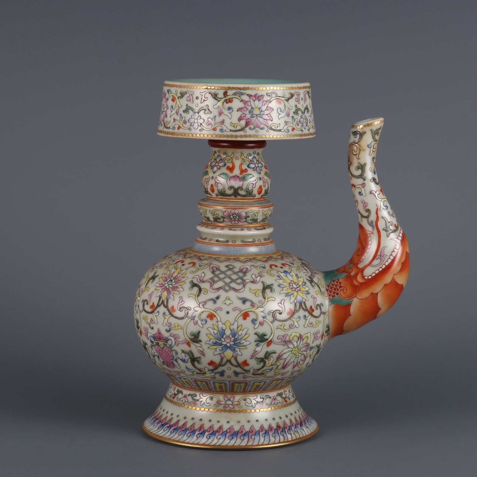 An Exquisite Famille-Rose Lotus Pattern Eight Treasures Pattern Ewer: An Exquisite Famille-Rose Lotus Pattern Eight Treasures Pattern Ewer Qing Dynasty, China Daoguang Six-character Mark Size:21cmx8.5cm (The Dimensions Of All Batches Are Manually Measured.If You Need