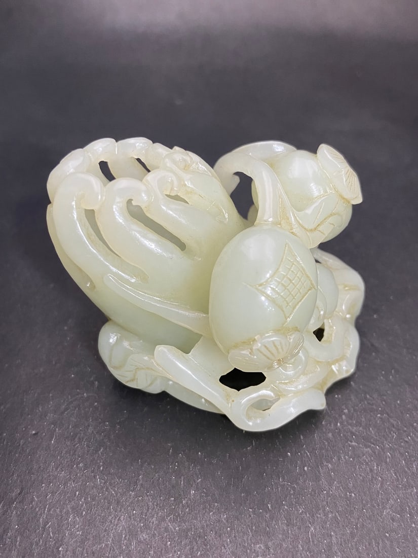 An Exquisite White Jade Melon and Fruit Pattern Ornament: An Exquisite White Jade Melon and Fruit Pattern Ornament Qing Dynasty, China Size:6.6cmx5.06cmx5.5cm Weight:209g (The Dimensions Of All Batches Are Manually Measured.If You Need More Detailed Informat