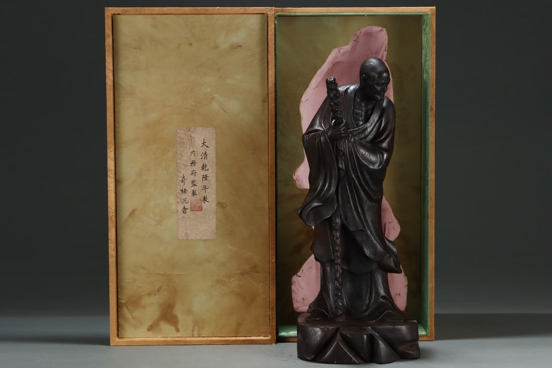 An Exquisite Eaglewood Statue of Arhat: An Exquisite Eaglewood Statue of Arhat Qing Dynasty, China Qianlong Six-character Mark Size:50.5cmx20.5cm (The Dimensions Of All Batches Are Manually Measured.If You Need More Detailed Information,