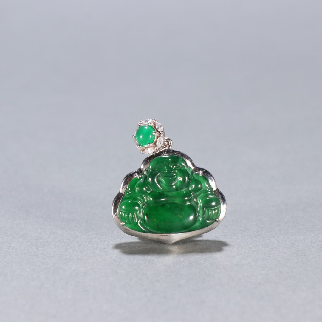 An Exquisite Jadeite Statue of Maitreya Buddha Pendant: An Exquisite Jadeite Statue of Maitreya Buddha Pendant Qing Dynasty, China Size:3.1cmx2.7cm Weight:7g (The Dimensions Of All Batches Are Manually Measured.If You Need More Detailed Information,