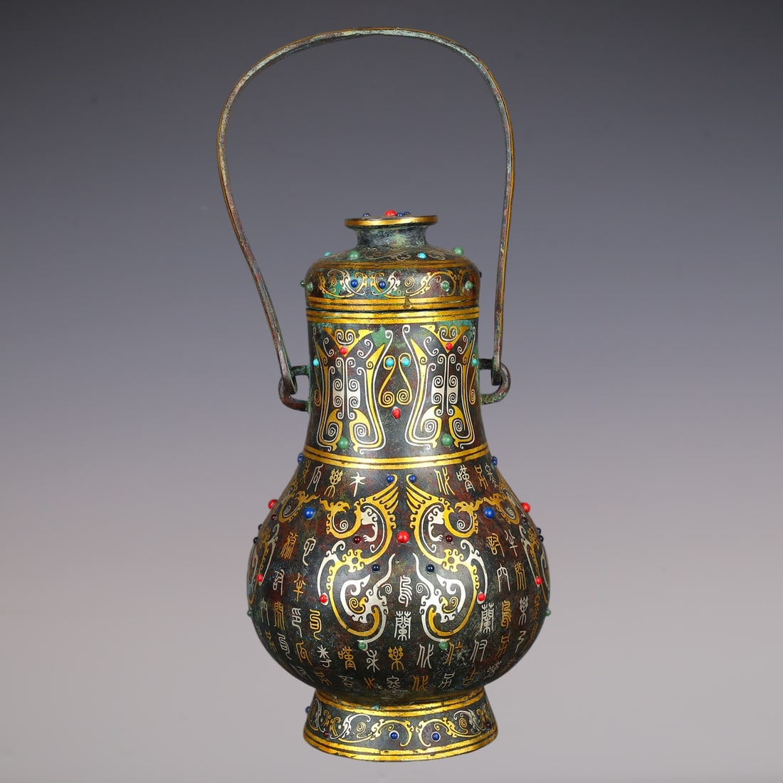 An Exquisite Bronze Inlaid Gold Inlaid Gems Phoenix Pattern With Inscription Ewer: An Exquisite Bronze Inlaid Gold Inlaid Gems Phoenix Pattern With Inscription Ewer Han Dynasty, China Size:20cmx20cmx49cm Weight:4640g (The Dimensions Of All Batches Are Manually Measured.If You Need