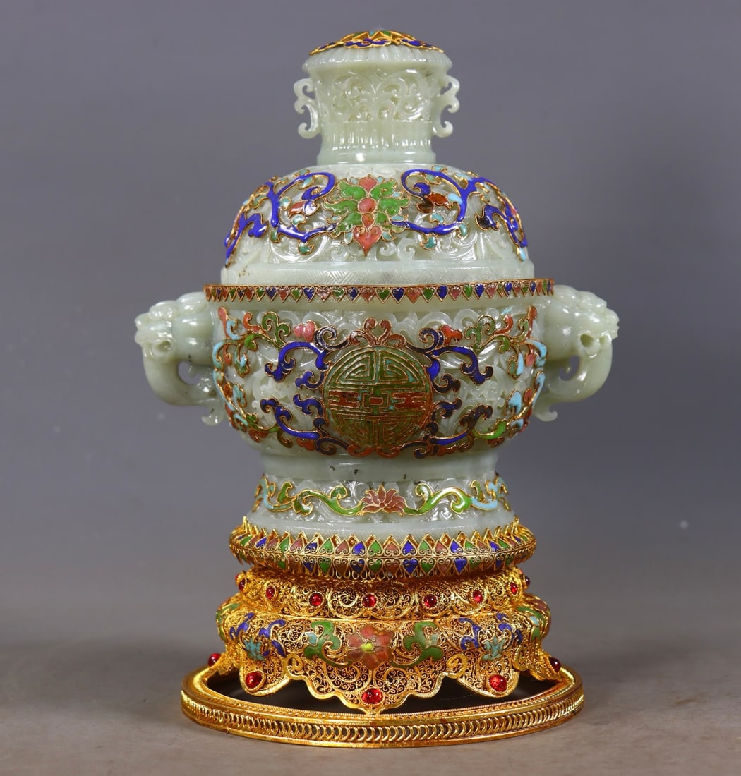An Exquisite Gilt Bronze Inlaid White Jade Lotus Pattern Double-Ears Censer: An Exquisite Gilt Bronze Inlaid White Jade Lotus Pattern Double-Ears Censer Qing Dynasty, China Qianlong Four-character Mark Size:23.5cmx15cmx14cm Weight:1414g (The Dimensions Of All Batches Are