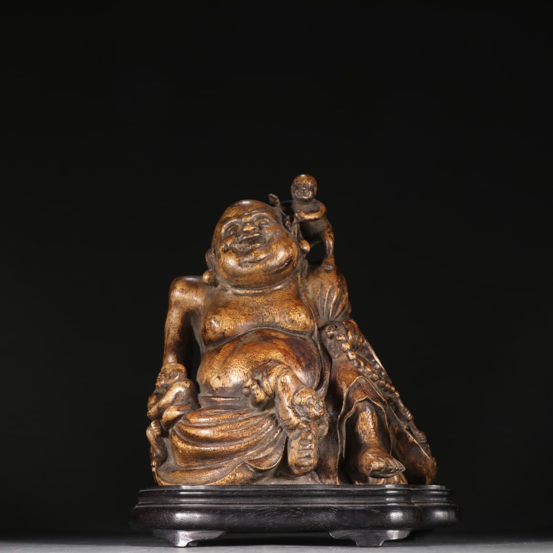 An Exquisite Eaglewood Statue of Maitreya Buddha: An Exquisite Eaglewood Statue of Maitreya Buddha Qing Dynasty, China Size:21cmx17.7cm Weight:840g (The Dimensions Of All Batches Are Manually Measured.If You Need More Detailed Information, Please