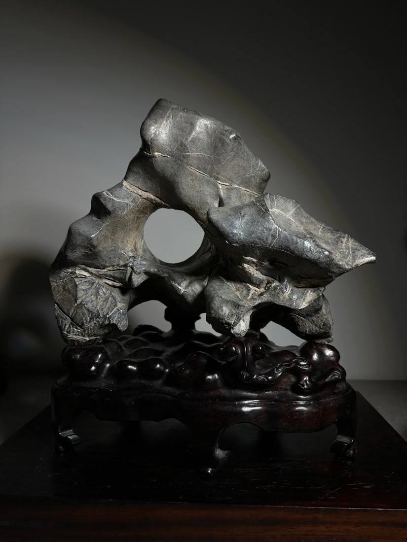 An Exquisite Taihu Stone Ornament: An Exquisite Taihu Stone Ornament Qing Dynasty, China Size:35cmx30cmx18cm (The Dimensions Of All Batches Are Manually Measured.If You Need More Detailed Information, Please Contact Our Customer