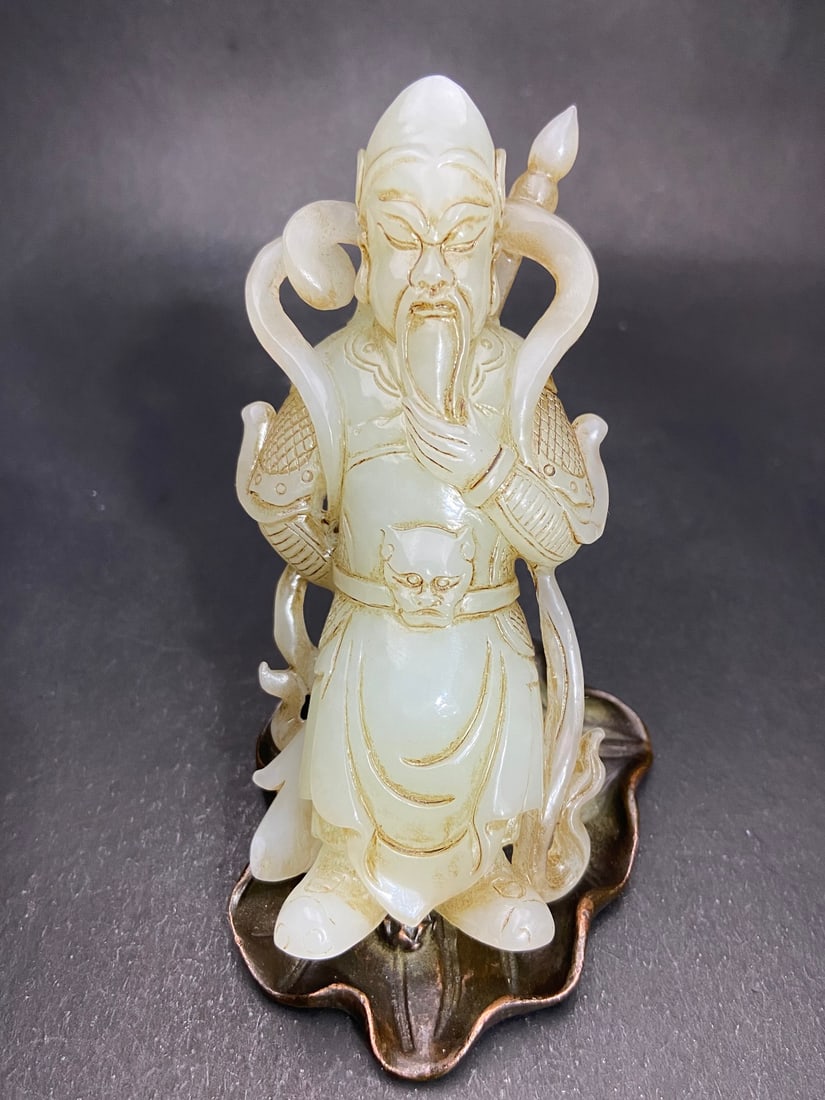 An Exquisite White Jade Statue of Mammon Ornament: An Exquisite White Jade Statue of Mammon Ornament Qing Dynasty, China Size:11.28cmx5.2cmx3cm Weight:194g (The Dimensions Of All Batches Are Manually Measured.If You Need More Detailed Information,