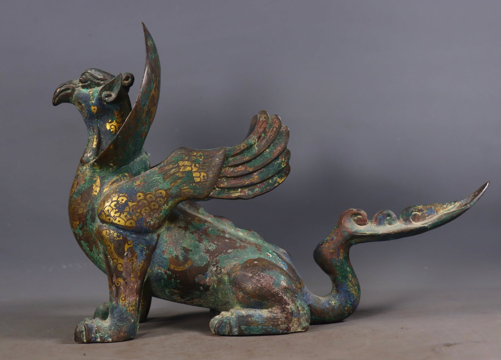An Exquisite Bronze Inlaid Gold and Silver Auspicious Beast Ornament: An Exquisite Bronze Inlaid Gold and Silver Auspicious Beast Ornament Han Dynasty, China Size:24cmx32.5cmx11cm Weight:2720g (The Dimensions Of All Batches Are Manually Measured.If You Need More