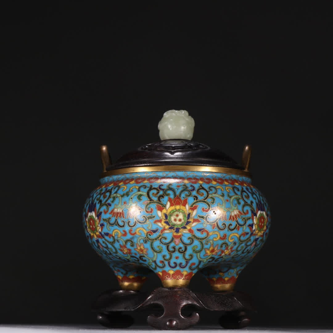 A Qing Dynasty bronze-gilt cloisonne three-legged incense burner with entwined lotus patterns: Qing Dynasty bronze gilt cloisonne three-legged incense burner with entwined lotus pattern SIZE: H:14cm W:11.2cm W:645.8g (The Dimensions Of All Batches Are Manually Measured.If You Need More