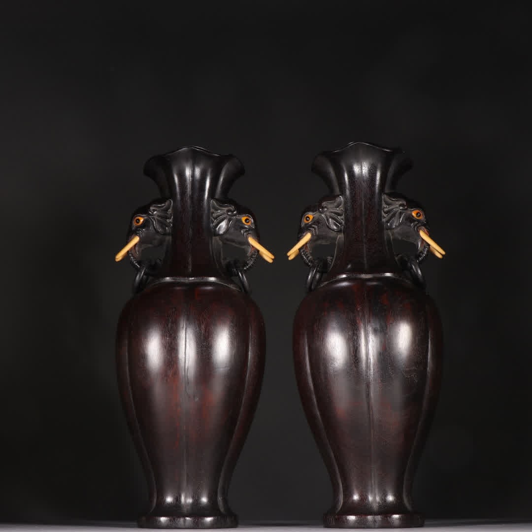 A pair of rosewood elephant ear vases: A pair of rosewood elephant-ear vases SIZE: H:30.4cm W:12cm Single W:1122.4g (The Dimensions Of All Batches Are Manually Measured.If You Need More Detailed Information, Please Contact Our Customer