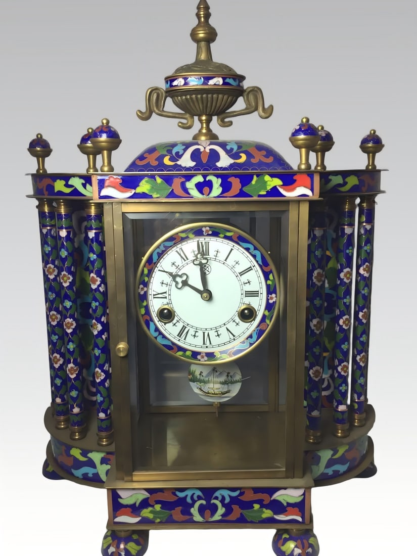 A late Qing dynasty bronze-bodied cloisonne enamel hand clock: Late Qing dynasty copper-bodied cloisonne enamel hand clock SIZE: 355x160x470mm7.25kg (The Dimensions Of All Batches Are Manually Measured.If You Need More Detailed Information, Please Contact Our