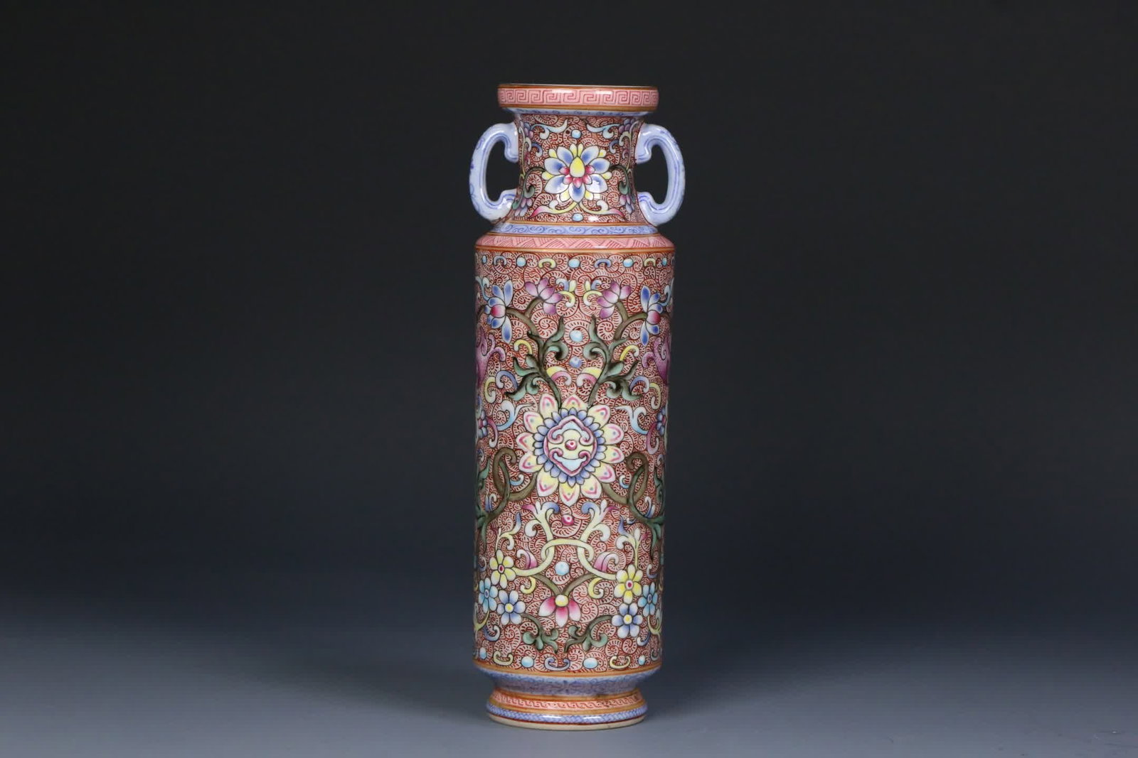 A Qing Dynasty Qianlong official kiln enamel entwined floral double-handled vase: Qing Dynasty Qianlong Official Kiln Enamel Colorful Entwined Floral Double-Handled Vase SIZE: 17x5.6cm (The Dimensions Of All Batches Are Manually Measured.If You Need More Detailed Information,