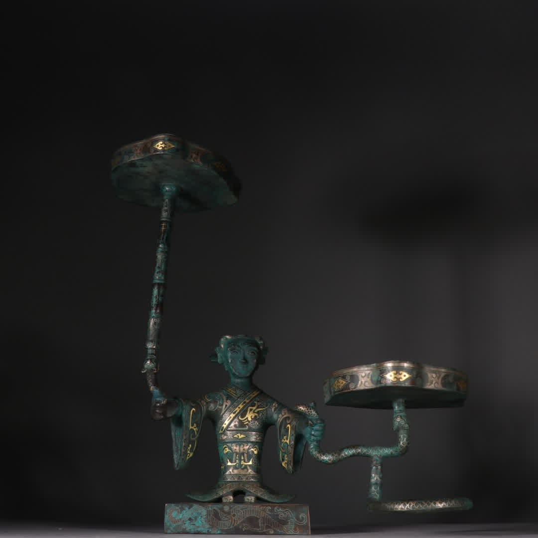 A Han Dynasty bronze inlaid gold and silver human lamp: Han Dynasty bronze inlaid gold and silver human lamp SIZE: H:33.5cm W:30cm W:3160g (The Dimensions Of All Batches Are Manually Measured.If You Need More Detailed Information, Please Contact Our