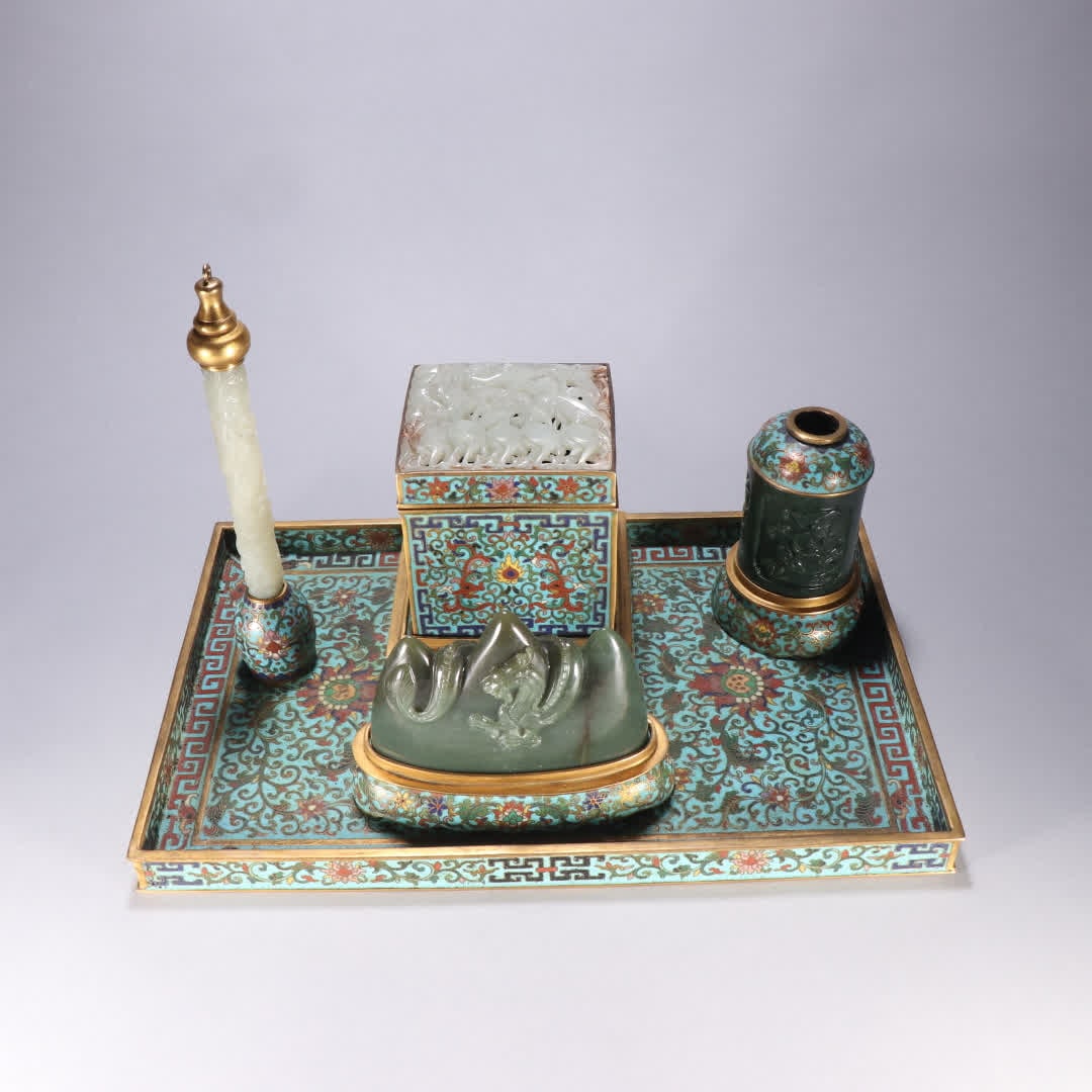 A set of gilt copper cloisonne scholar's four treasures: A set of gilt bronze cloisonne scholar's four treasures SIZE: Brush L: 19.8cm W: 3.5cm Box H: 12cm W: 11cm Brush Holder H: 10.3cm W: 16cm Water Basin H: 10.4cm W: 7.3cm Total W: 4069.8g (The
