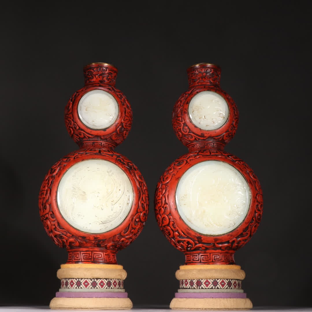 A pair of Qing dynasty bronze-bodied, gilded, red-carved Hetian jade gourd appreciation vases (1 of 9)