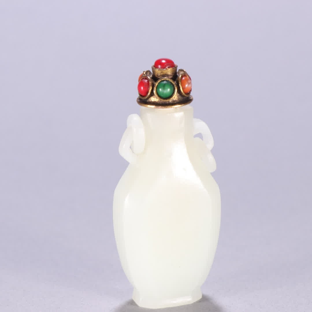 A Qing Dynasty Hetian jade snuff bottle with a ring on both ears: Qing Dynasty Hetian jade double-handled snuff bottle with rings held in the mouth SIZE: H:7.1cm W:3.1cm W:48.8g (The Dimensions Of All Batches Are Manually Measured.If You Need More Detailed