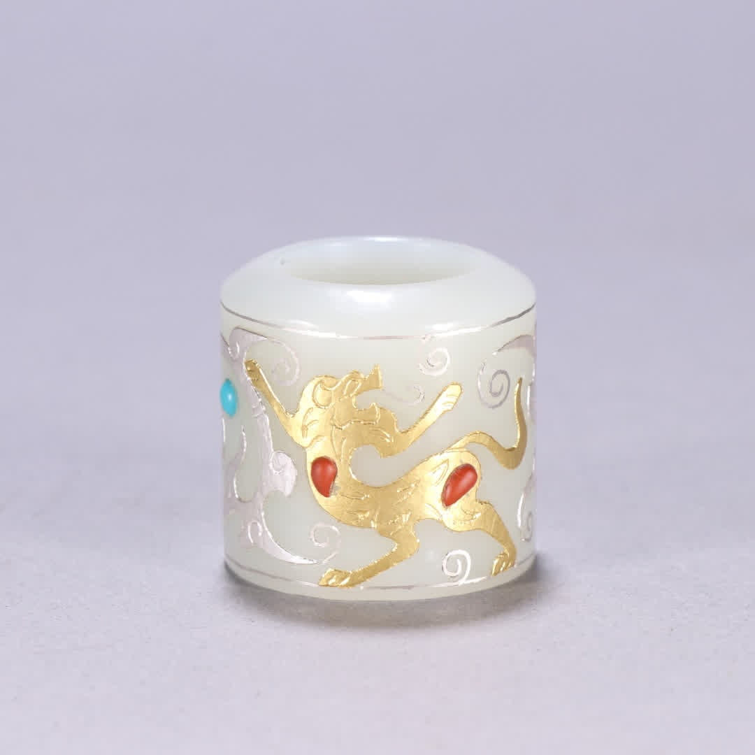 One Hetian jade inlaid gold and silver beast pattern thumb ring: Hetian jade inlaid with gold and silver beast pattern thumb rings SIZE: Inner diameter 2.1cm W: 3.2cm W: 47.1g (The Dimensions Of All Batches Are Manually Measured.If You Need More Detailed