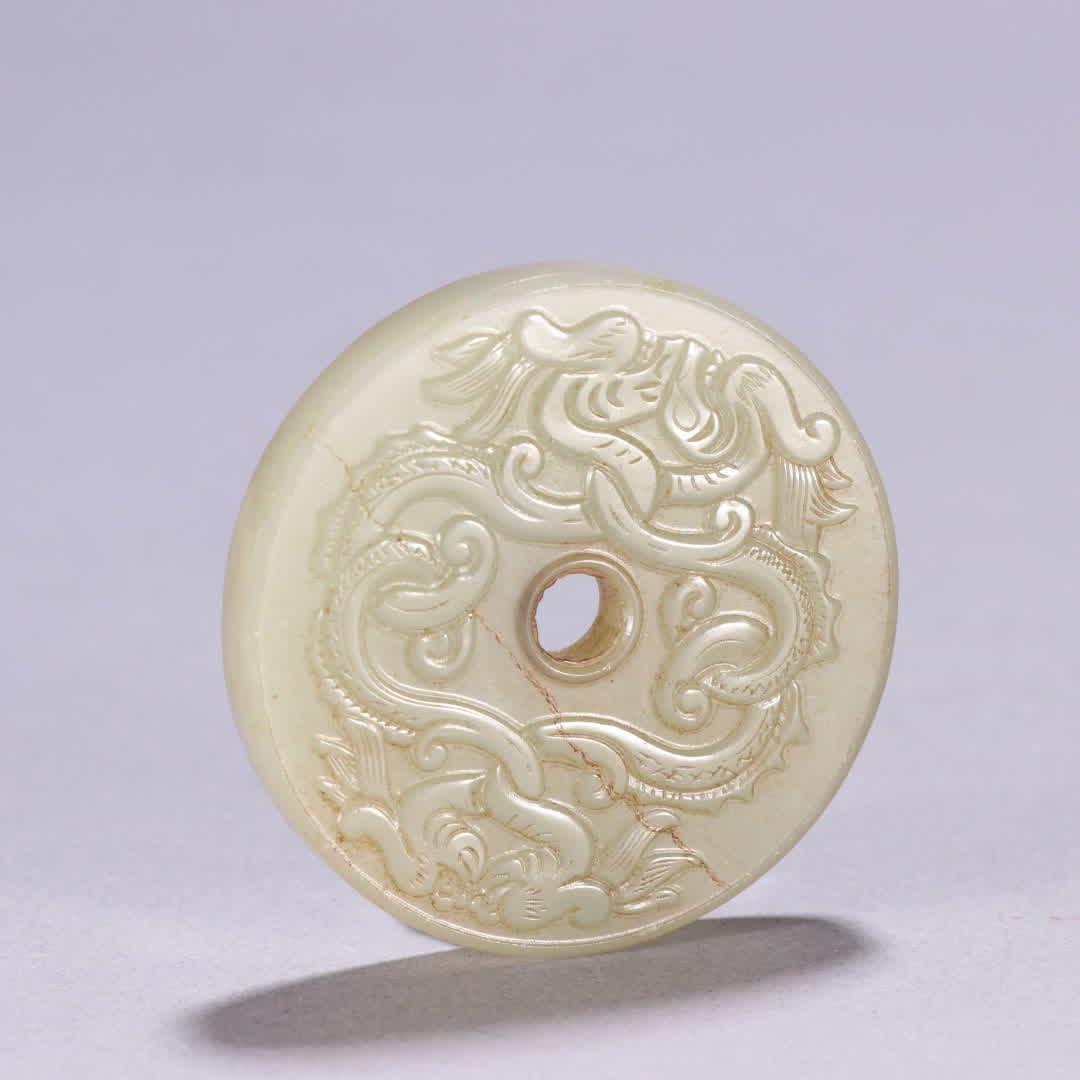 A Hetian jade double-dragon patterned bi: Hetian jade double-dragon patterned bi SIZE: W:5.1cm W:40g (The Dimensions Of All Batches Are Manually Measured.If You Need More Detailed Information, Please Contact Our Customer Service Before