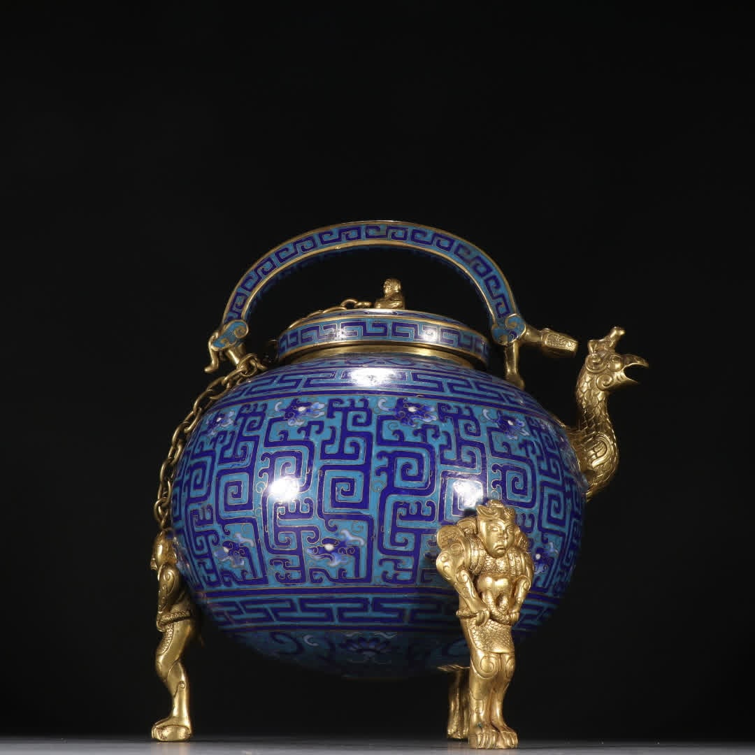 A Qing Dynasty bronze gilt cloisonne three-legged handlebar: Qing Dynasty bronze gilt cloisonne three-legged handle pot SIZE: H:26cm W:23cm W:3800g (The Dimensions Of All Batches Are Manually Measured.If You Need More Detailed Information, Please Contact Our Cu