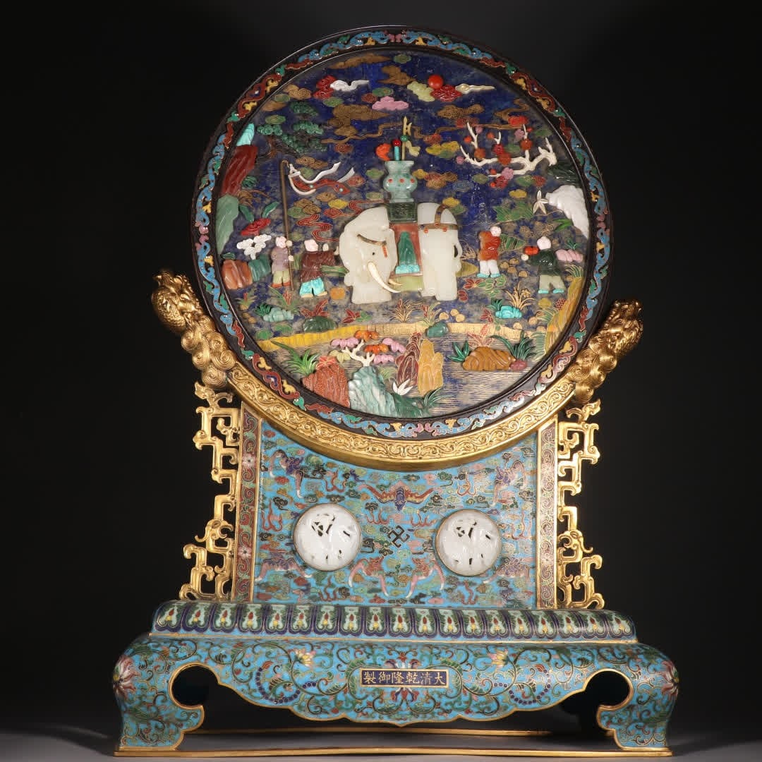 A Qing Dynasty bronze gilt cloisonne inlaid with lapis lazuli, inlaid with a screen featuring a: Qing Dynasty: Gilt bronze, cloisonne inlaid with lapis lazuli, inlaid with a hundred treasures and a child playing elephant inserted screen SIZE: H:56cm W:41cm W:6.8kg (The Dimensions Of All Batches