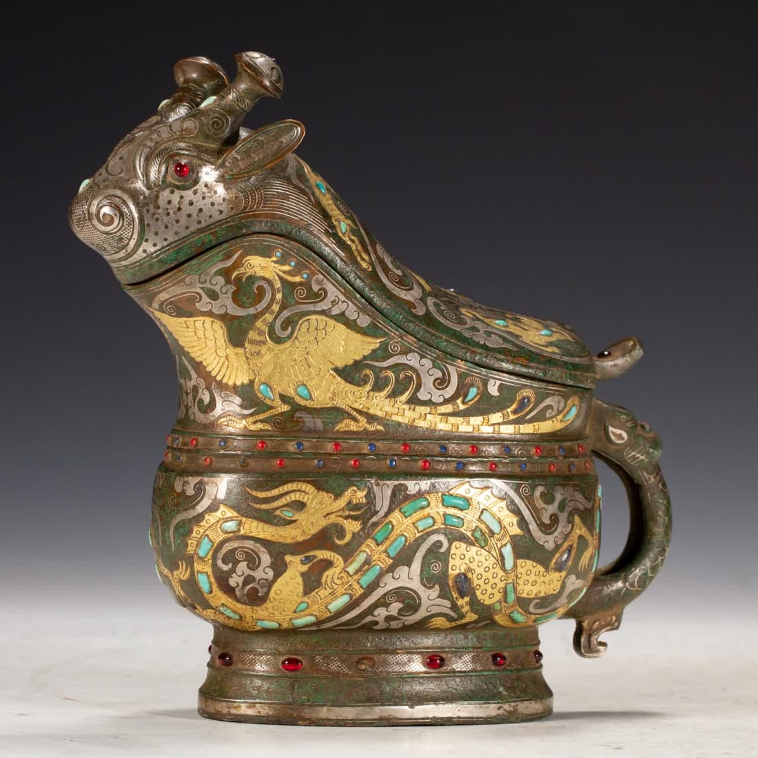One Han Dynasty wine goblet inlaid with gold and silver: In the Han dynasty, gold and silver wine cups were inlaid inlaid with gold SIZE: L:18cm W:7cm H:19cm W:1020g (The Dimensions Of All Batches Are Manually Measured.If You Need More Detailed