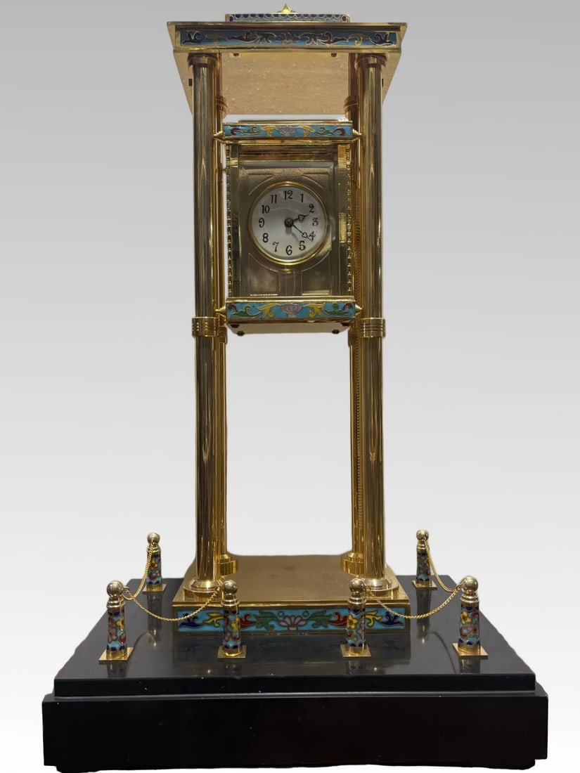 A late Qing enamel art rising clock: Late Qing enamel art rising and falling bells SIZE: L:30cm W:20cm H:55cm (The Dimensions Of All Batches Are Manually Measured.If You Need More Detailed Information, Please Contact Our Customer Service