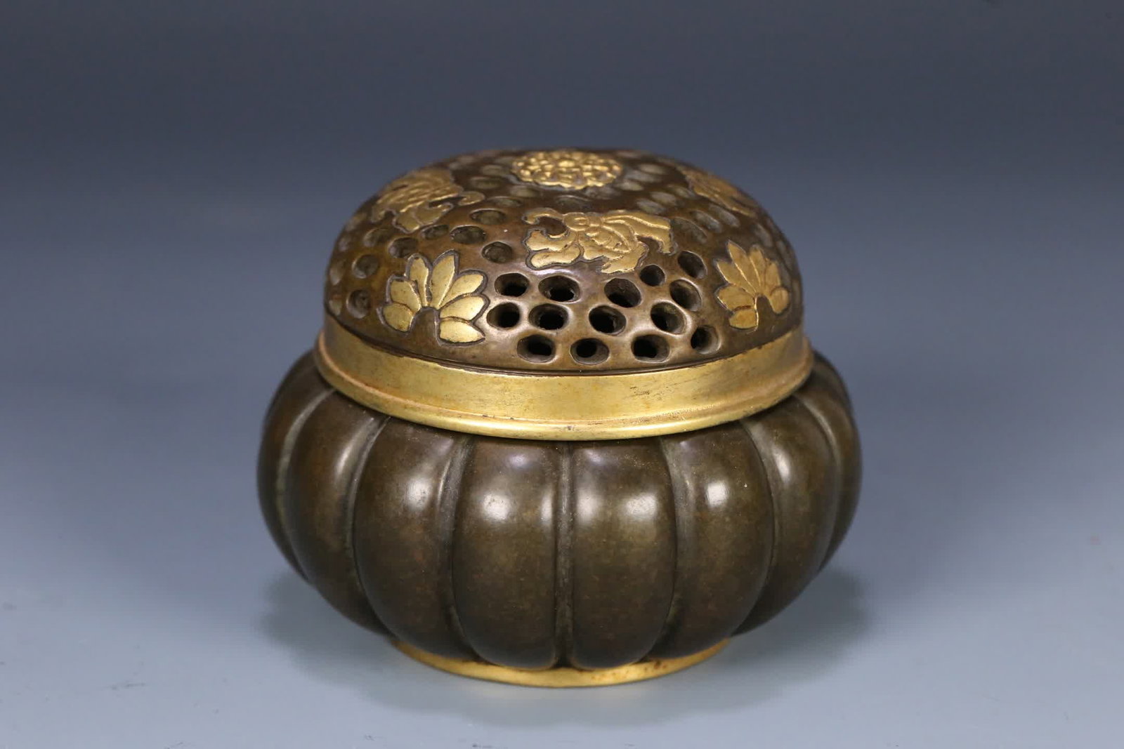 A Qing Dynasty Qianlong period gilded melon-ridge copper incense burner: Qing Dynasty Qianlong period gilded melon-ridge copper incense burner SIZE: 8.1x6.4cm W:440g (The Dimensions Of All Batches Are Manually Measured.If You Need More Detailed Information, Please Contact