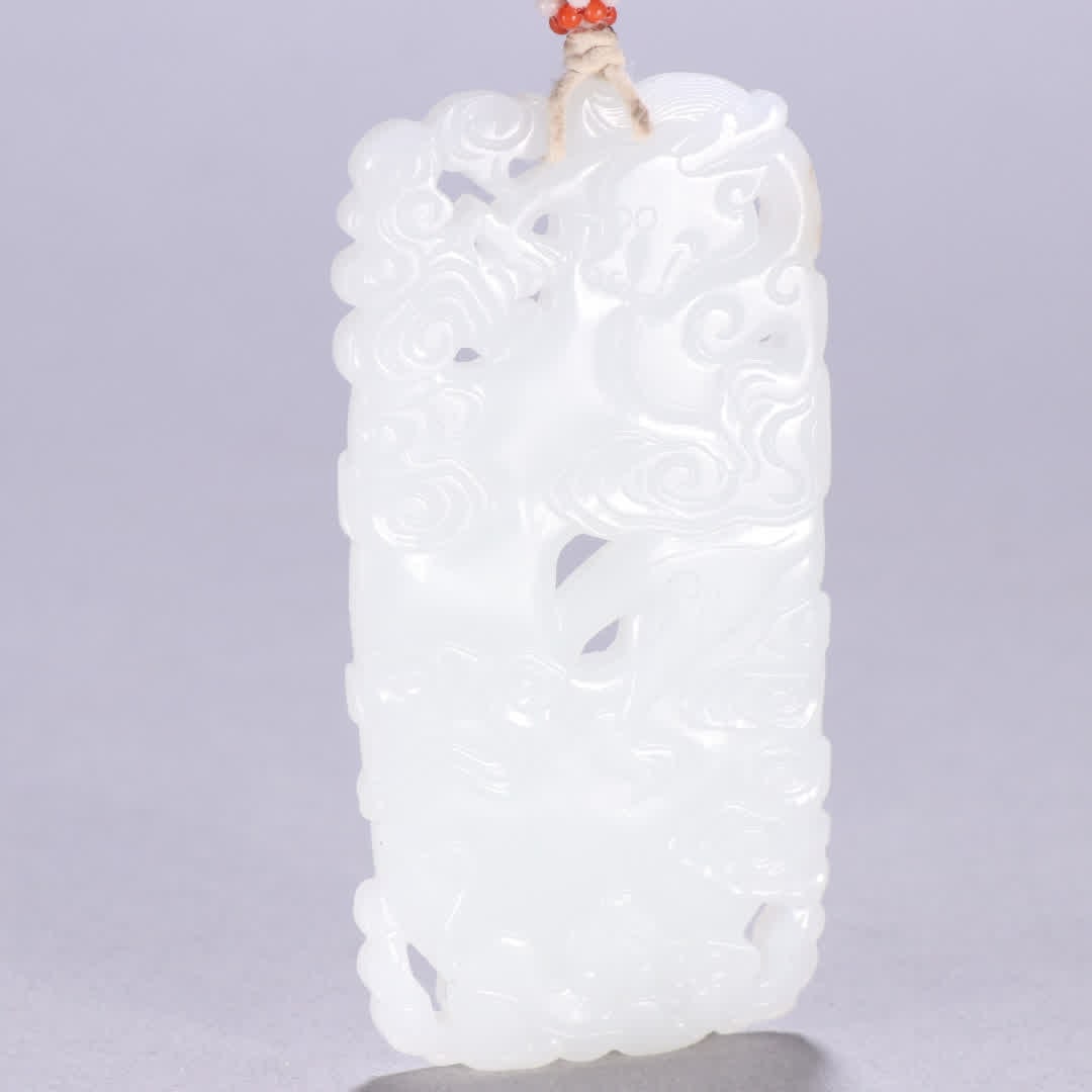 A Qing Dynasty Hetian jade pendant with cloud and dragon motifs: Qing Dynasty Hetian jade cloud and dragon pattern pendant SIZE: H:9cm W:4.4cm W:60g (The Dimensions Of All Batches Are Manually Measured.If You Need More Detailed Information, Please Contact Our