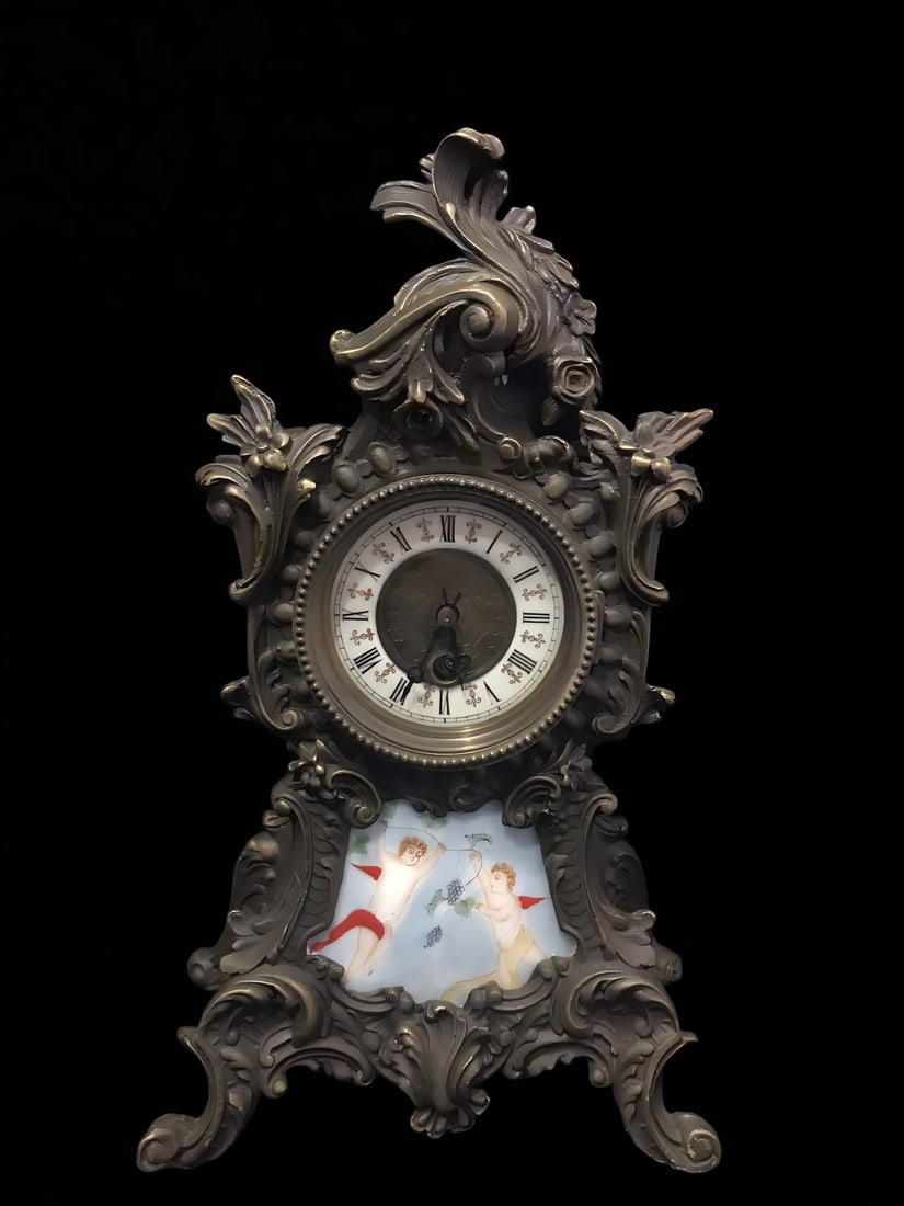 A late Qing dynasty European Rococo-style copper-bodied enamel table clock: A late Qing dynasty European-style Rococo-style bronze-bodied enamel table clock SIZE: L:18cm H:36cm (The Dimensions Of All Batches Are Manually Measured.If You Need More Detailed Information, Please 