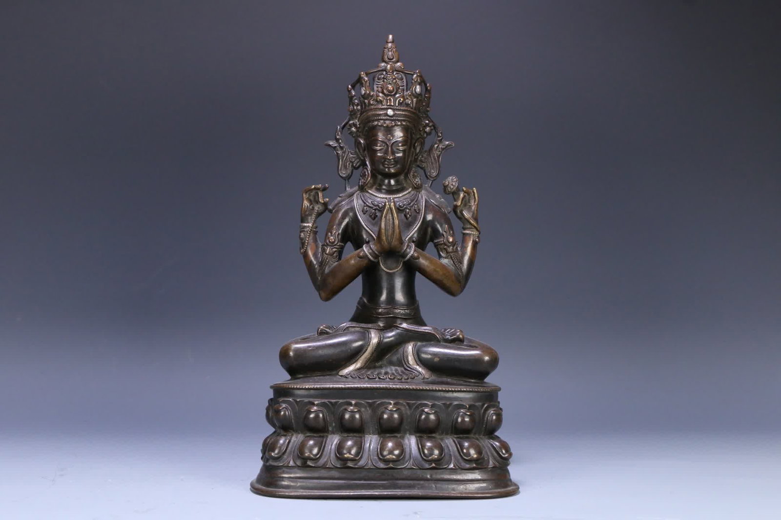 An early Tibetan bronze four-armed Guanyin statue inlaid with silver alloy: Early Tibetan bronze bronze inlaid silver four-armed Guanyin statue SIZE: H:30cm Bottom 17.5x12cm W:2645g (The Dimensions Of All Batches Are Manually Measured.If You Need More Detailed Information,
