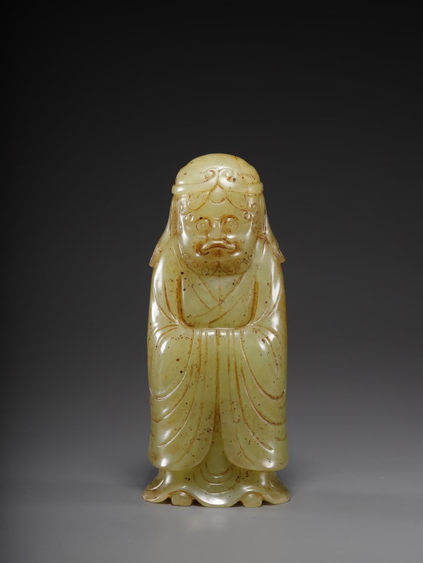 A Hetian yellow jade standing statue of a Hu person: Standing statue of a Hu man in yellow jade of Hetian SIZE: 11.7x4.8x3.5cm W:357.6g (The Dimensions Of All Batches Are Manually Measured.If You Need More Detailed Information, Please Contact Our