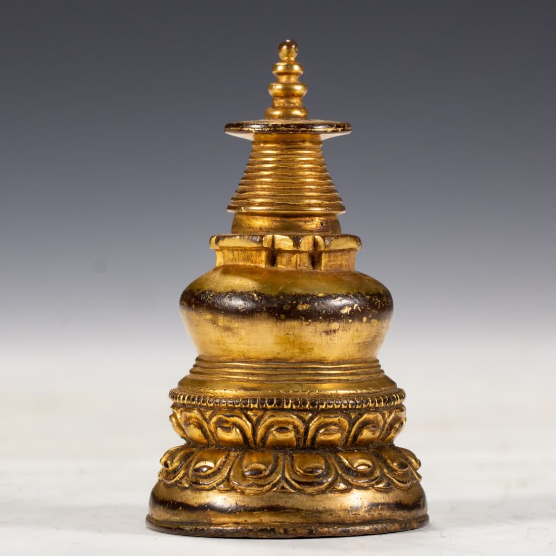 A Qing Dynasty gilded bronze pagoda: A gilded bronze pagoda from the Qing Dynasty SIZE: L:5cm W:5cm H:8cm W:230g (The Dimensions Of All Batches Are Manually Measured.If You Need More Detailed Information, Please Contact Our Customer