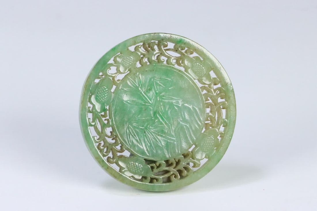 A Qing Dynasty old jadeite round plaque carved with bamboo, stone, flowers, and pine tree patterns (1 of 10)