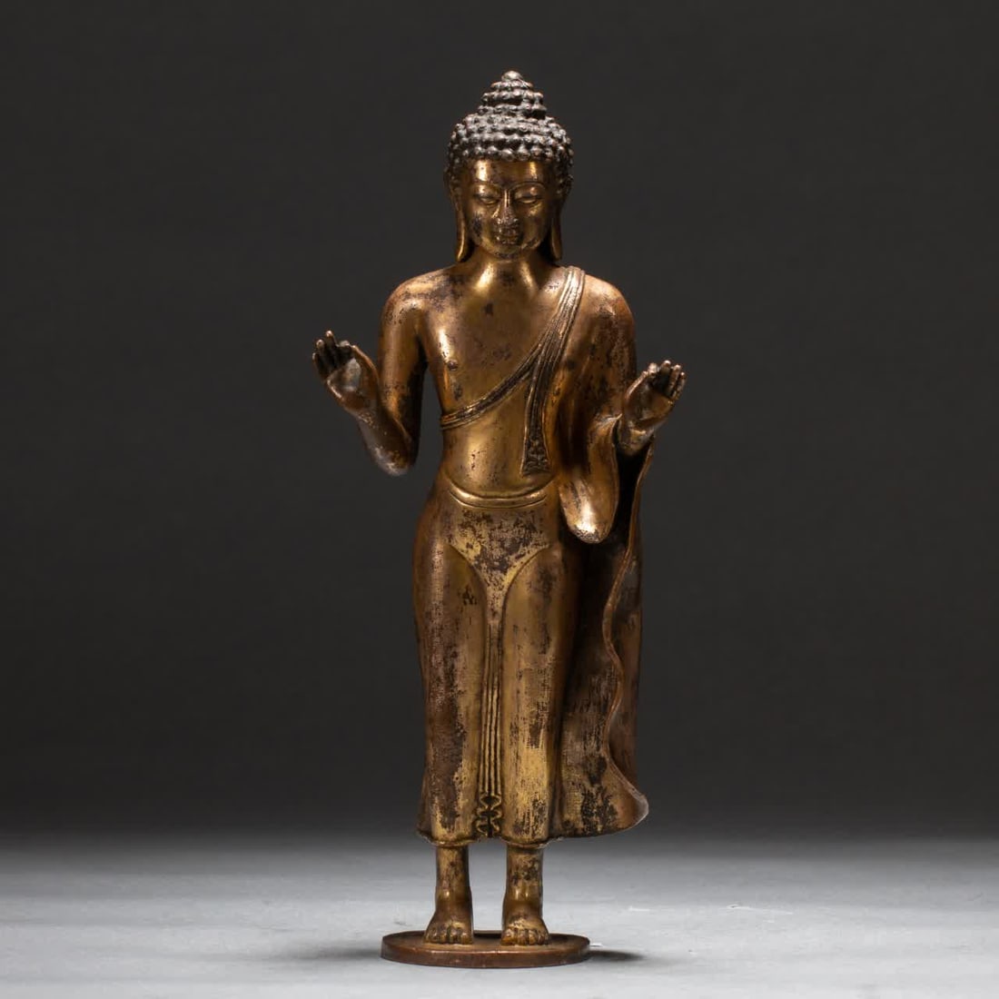 A Qing Dynasty gilt bronze Buddha statue: A gilt bronze Buddha statue from the Qing Dynasty SIZE: L:10.5cm W:6cm H:24.5cm W:1190g (The Dimensions Of All Batches Are Manually Measured.If You Need More Detailed Information, Please Contact Our